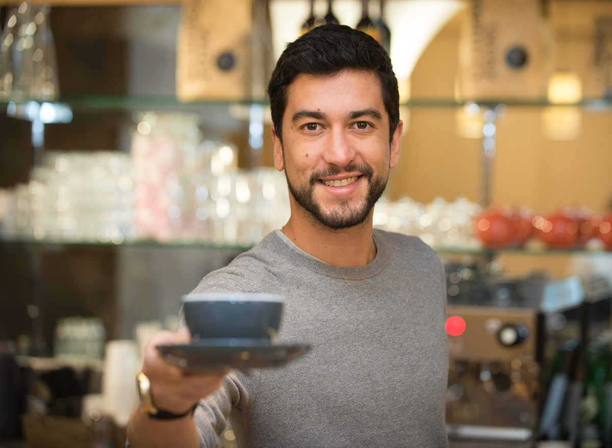 Barista serving coffee