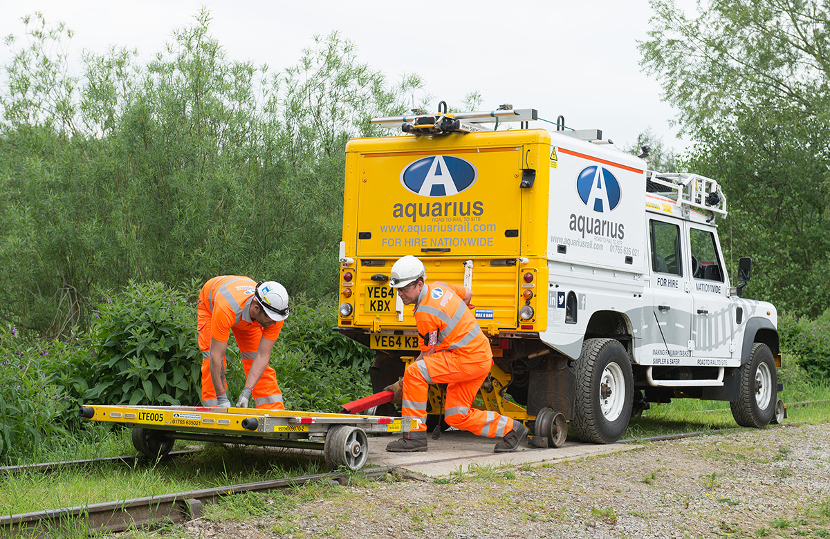 Aquarius Rail Landrover and trailor on rails